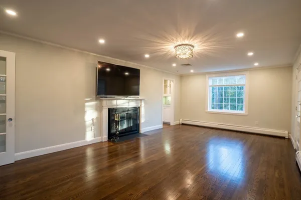 a view of a kitchen with a sink and a fireplace