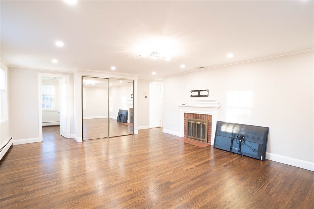 40 Puddingstone Lane Newton, MA 02459 - Photo 26 of 32 a view of a kitchen with a sink and a fireplace