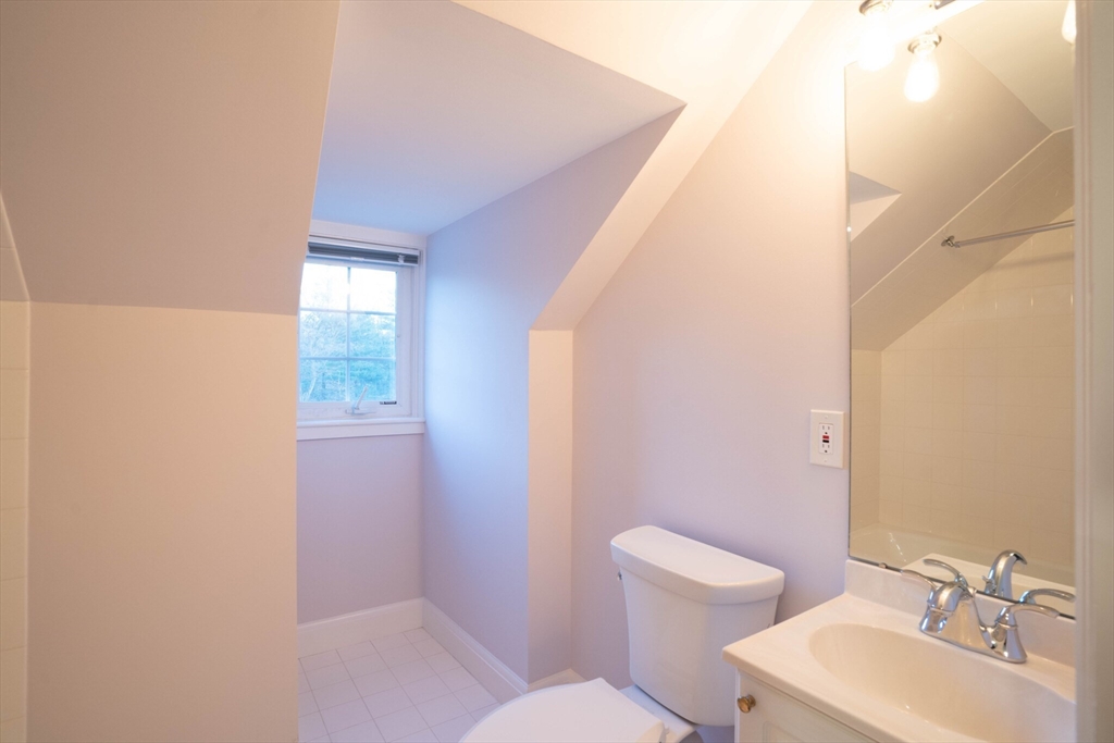 40 Puddingstone Lane Newton, MA 02459 - Photo 30 of 32 a bathroom with a toilet sink and mirror