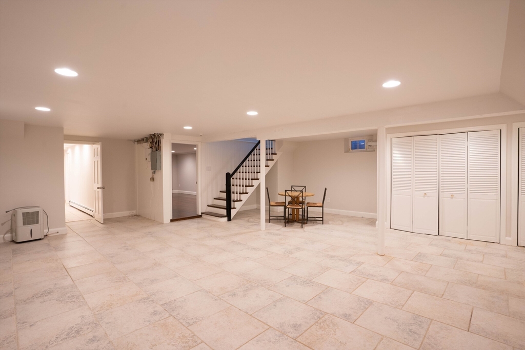 40 Puddingstone Lane Newton, MA 02459 - Photo 7 of 32 an empty room with furniture and natural light