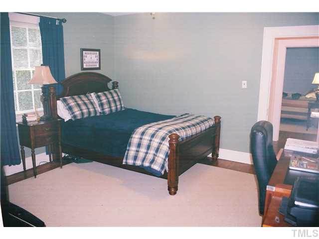 3306 Hall Street Raleigh, NC 27607 - Photo 5 of 6 a bedroom with a bed dresser and a window