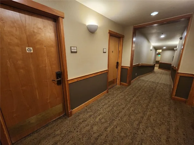 a view of a hallway with closet