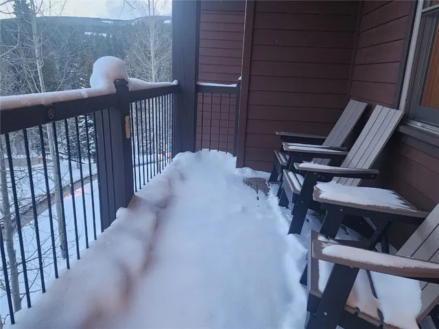 a view of balcony with two chairs and a table