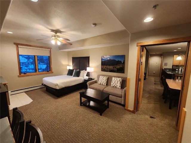 a bedroom with furniture and a wooden floor