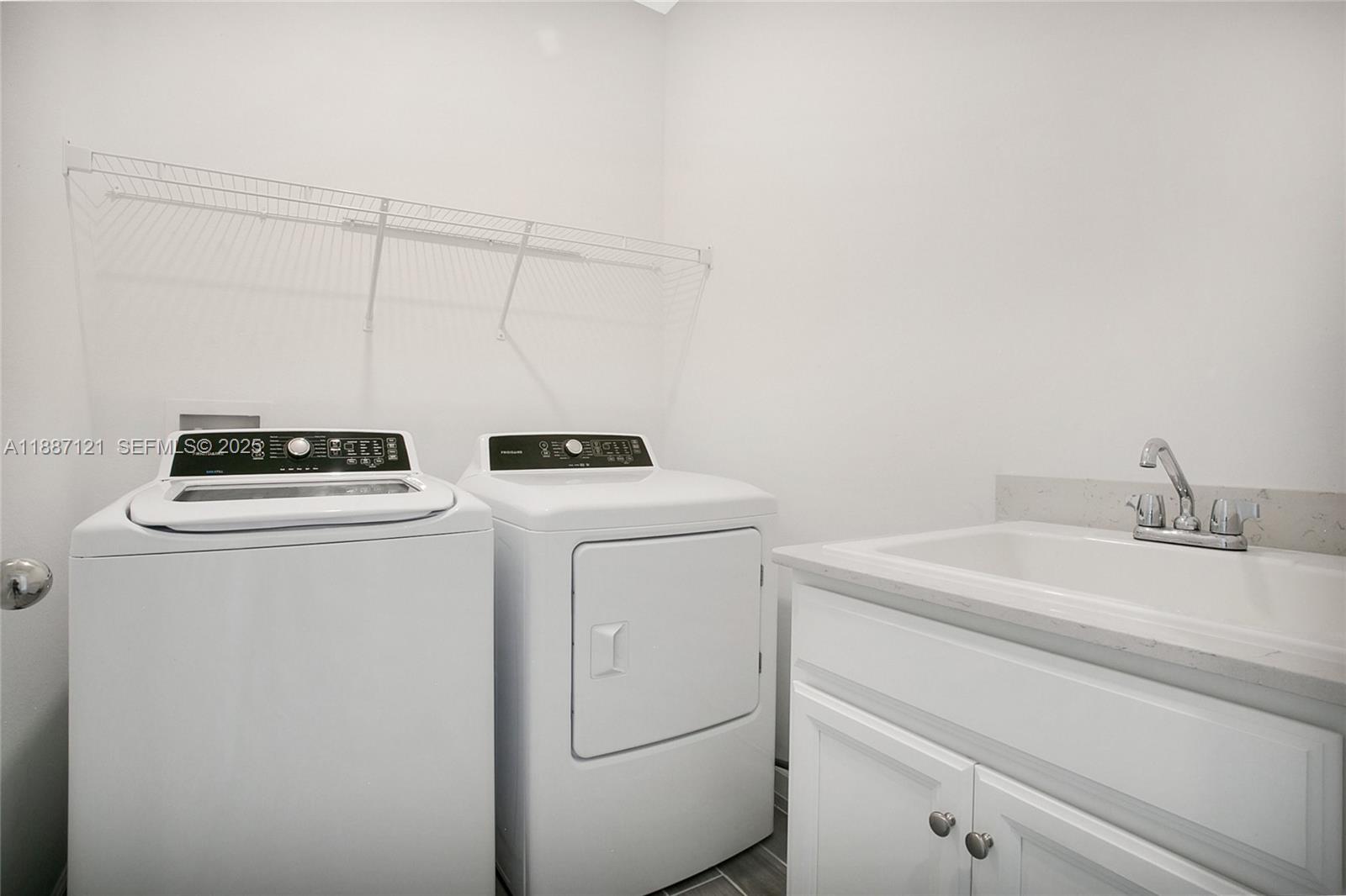 7796 Southwest 74th Loop Ocala, FL 34481 - Photo 13 of 20 a utility room with dryer and washer