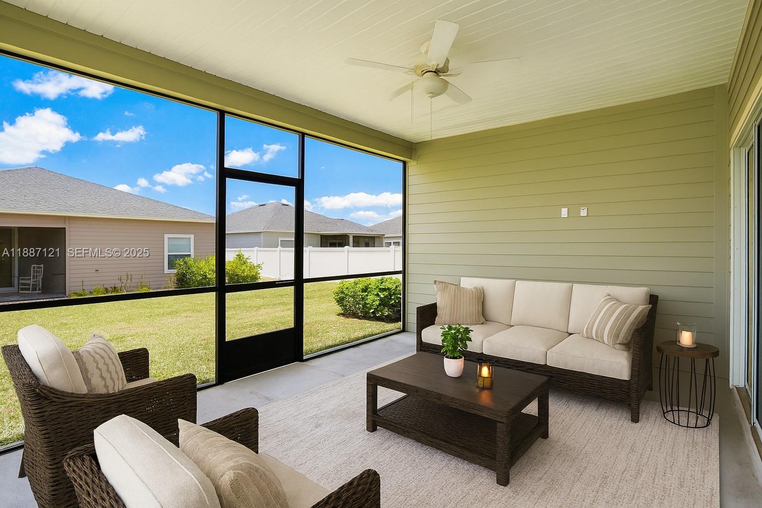 7796 Southwest 74th Loop Ocala, FL 34481 - Photo 5 of 20 a living room with furniture and a large window