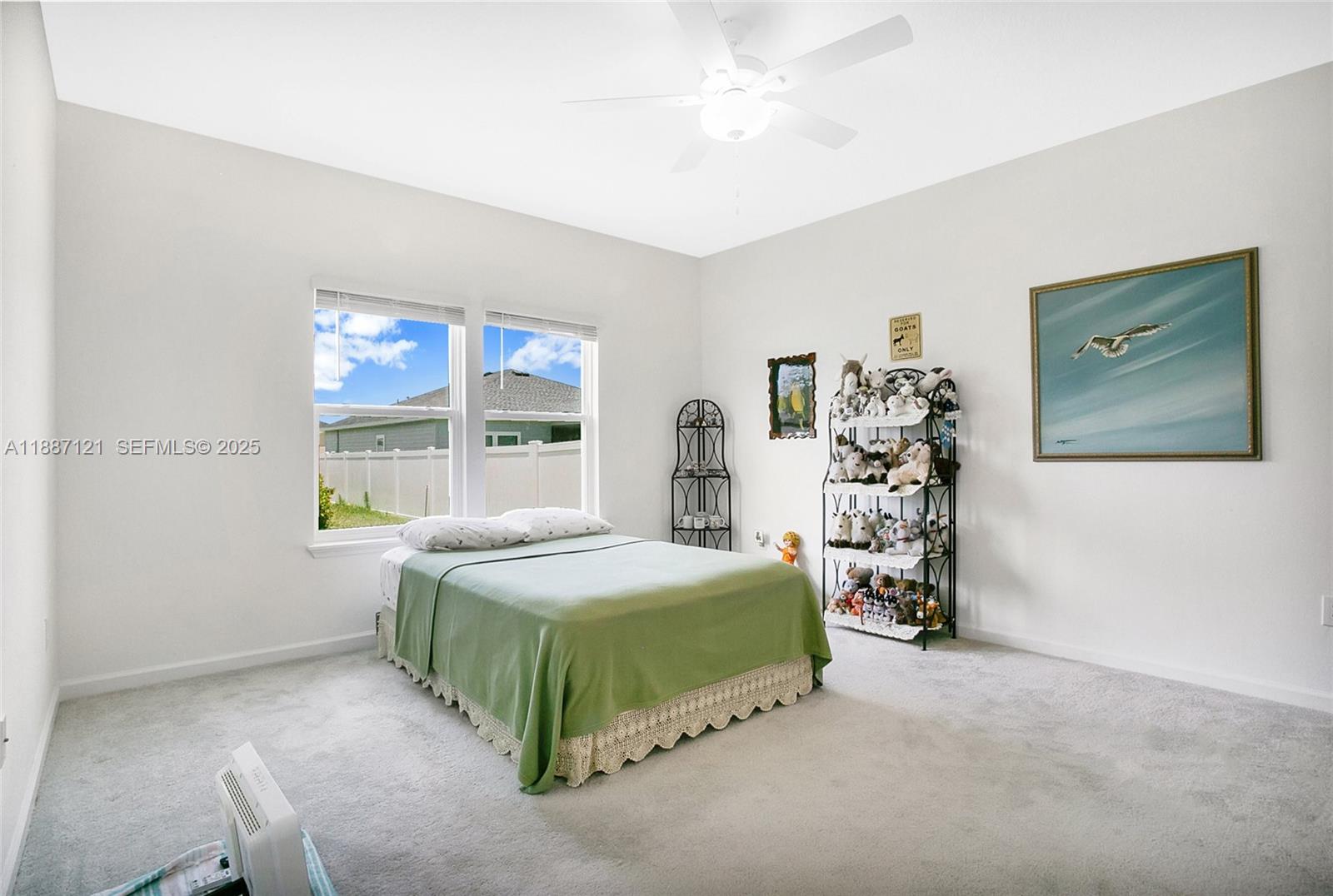 7796 Southwest 74th Loop Ocala, FL 34481 - Photo 6 of 20 a bedroom with a bed and a window