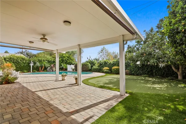 a view of a couches in backyard of house