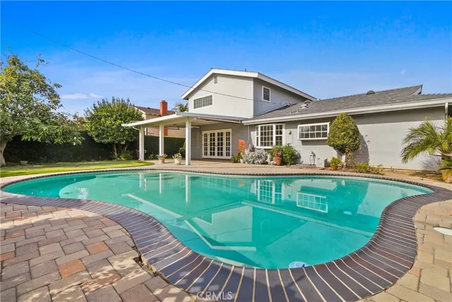 a view of a house with a swimming pool