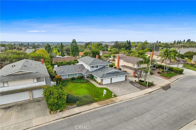a view of a garden with houses