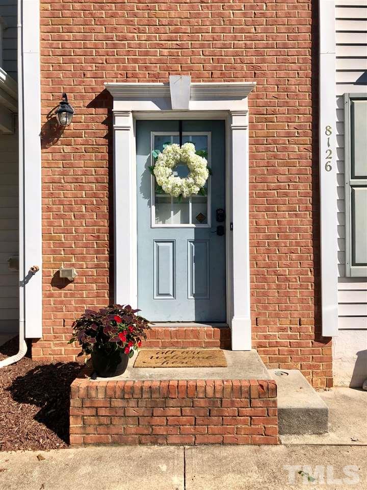 8126 Rhiannon Road Raleigh, NC 27613 - Photo 2 of 24 a front view of a house with outdoor space