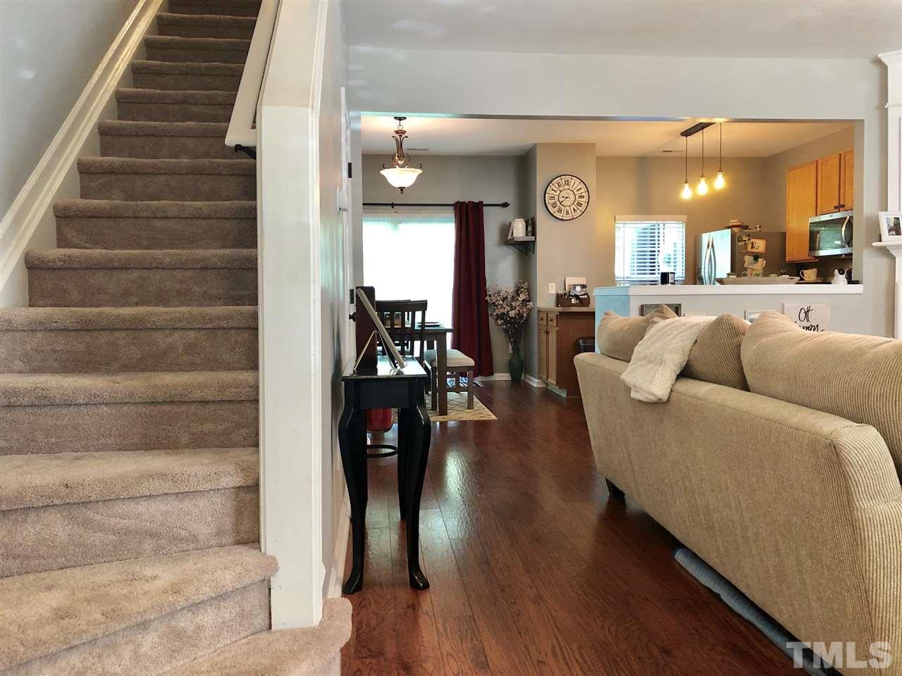 8126 Rhiannon Road Raleigh, NC 27613 - Photo 4 of 24 a living room with furniture and wooden floor