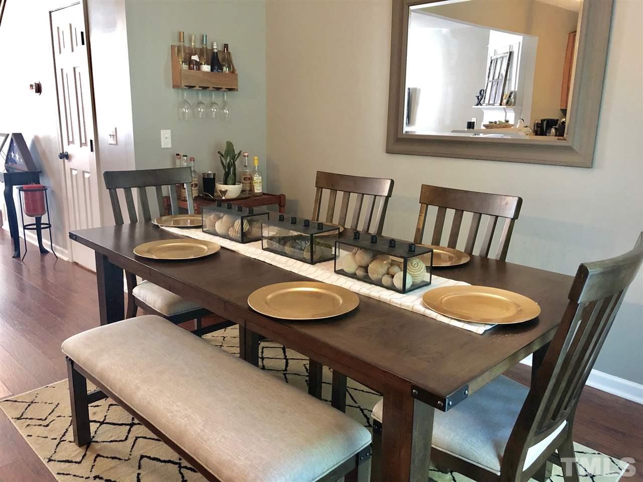 8126 Rhiannon Road Raleigh, NC 27613 - Photo 9 of 24 a view of a dining room with furniture