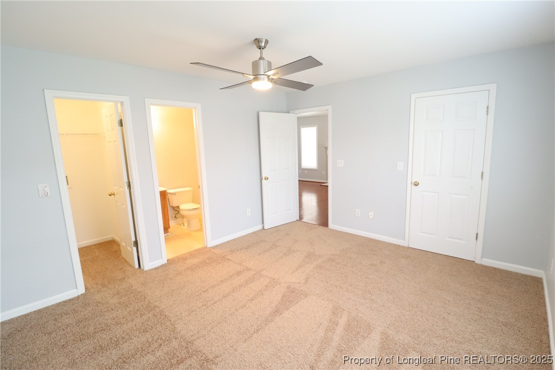 4105 Scofield Drive Raleigh, NC 27610 - Photo 15 of 27 a view of empty room with wooden floor