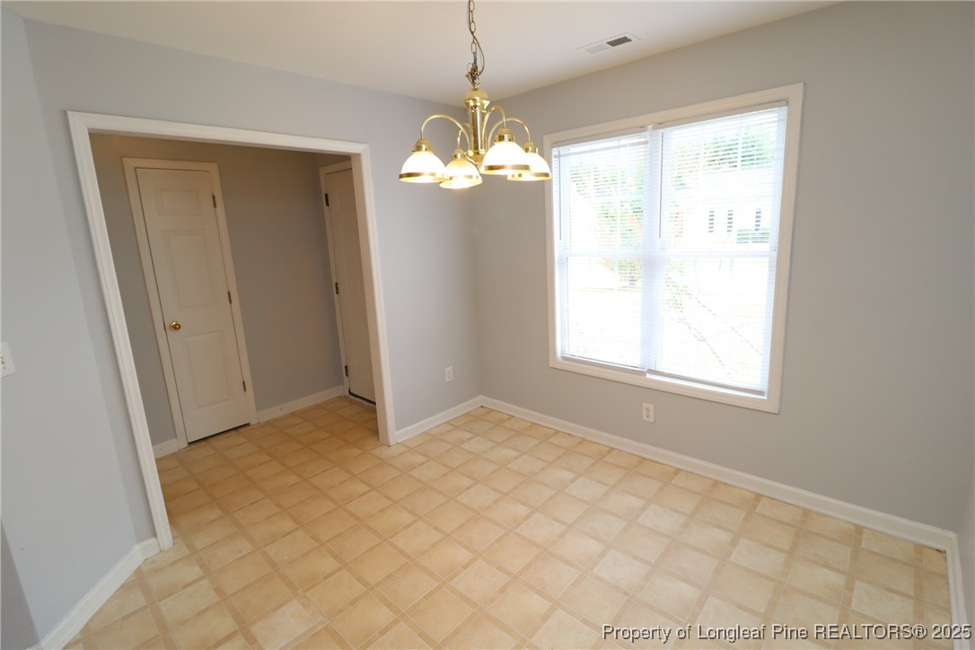 4105 Scofield Drive Raleigh, NC 27610 - Photo 4 of 27 a view of an empty room with a window