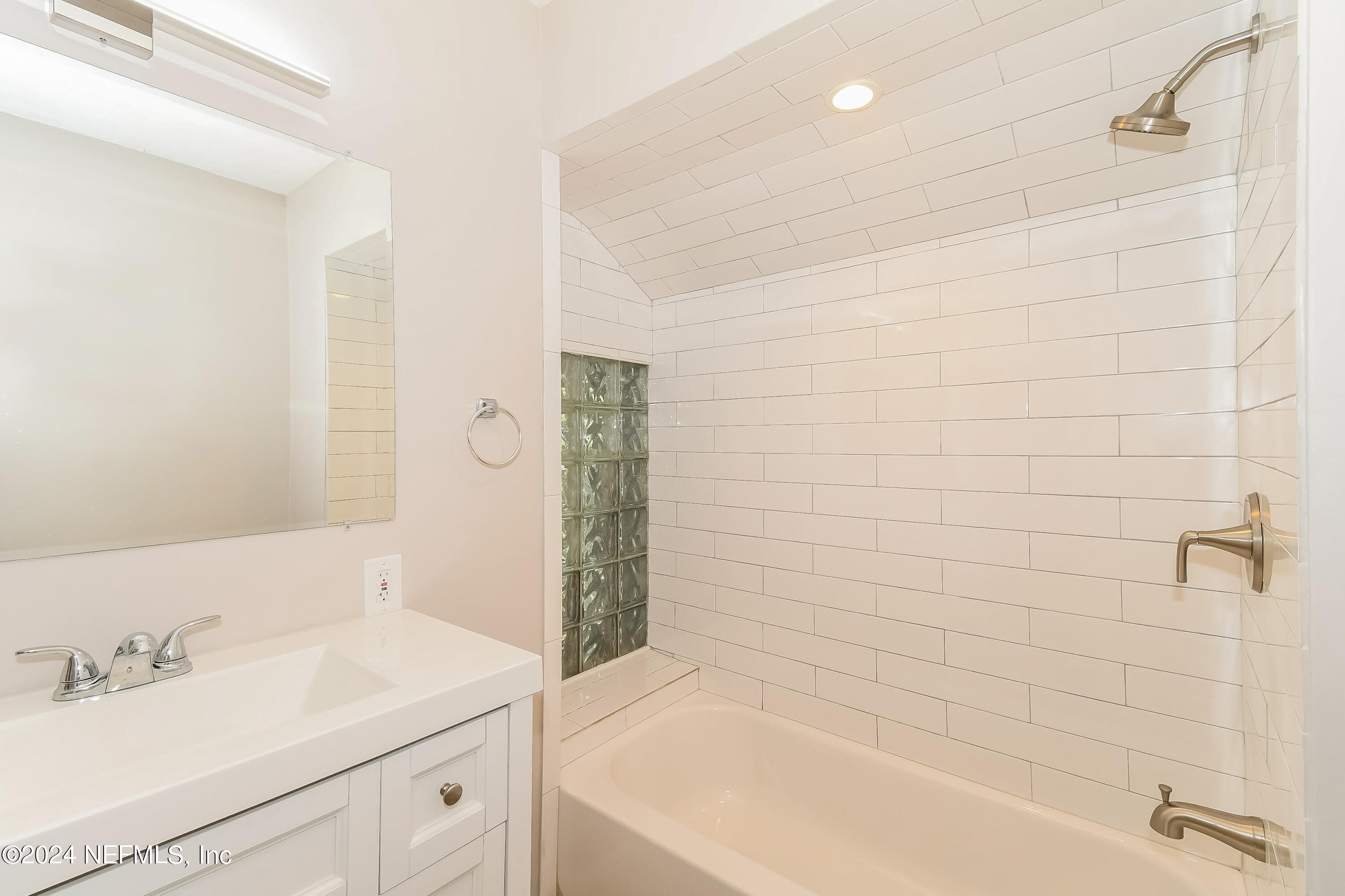 7070 Perke Drive Jacksonville, FL 32210 - Photo 14 of 16 a bathroom with a sink and a bathtub