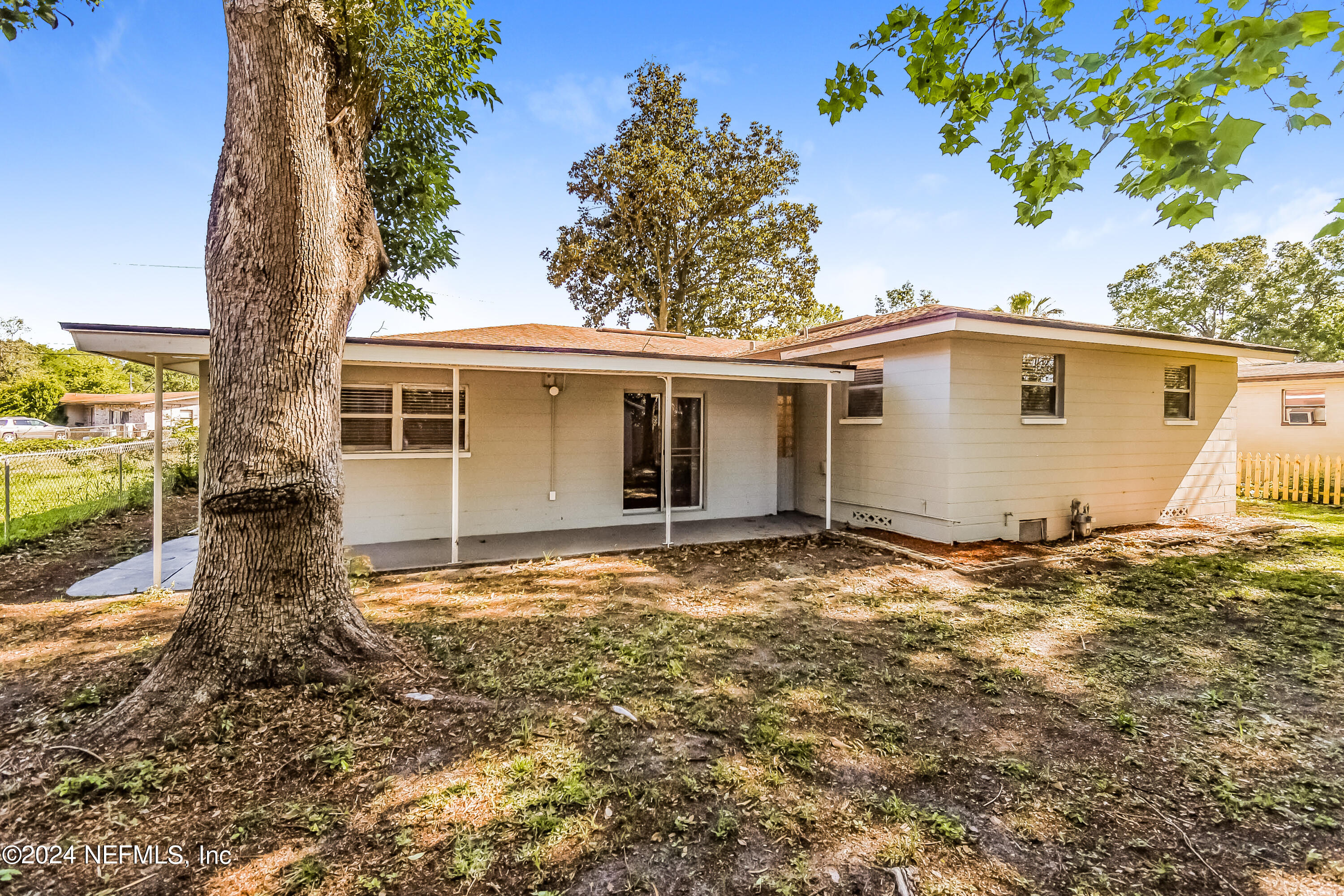 7070 Perke Drive Jacksonville, FL 32210 - Photo 15 of 16 front view of a house with a yard