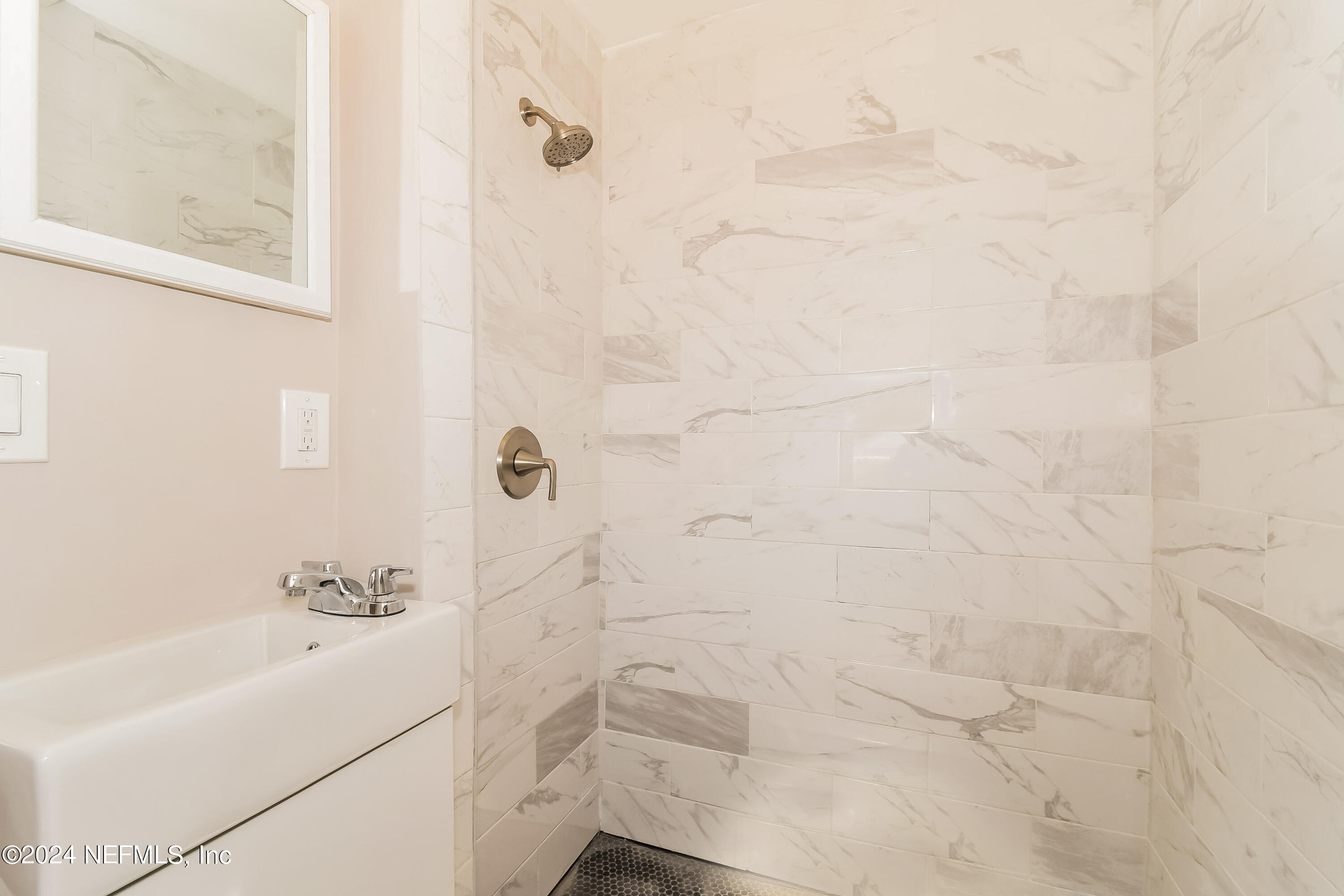 7070 Perke Drive Jacksonville, FL 32210 - Photo 8 of 16 a bathroom with a shower