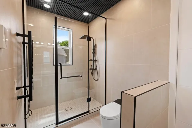 a bathroom with a glass shower door