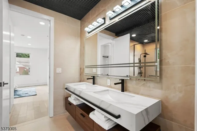 a bathroom with a sink a vanity and a mirror