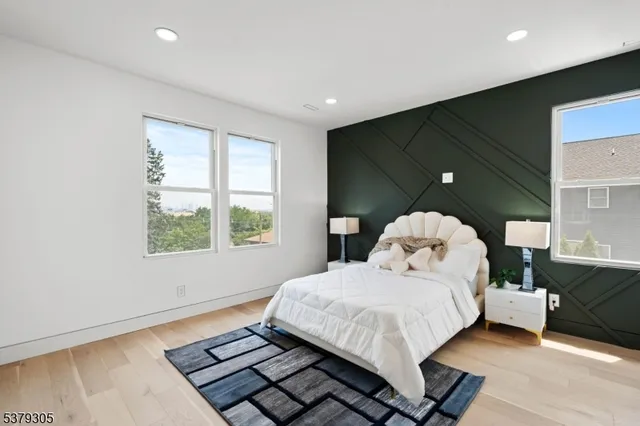 a bed sitting in a room next to a window