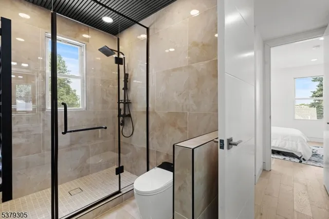 a bathroom with a shower and toilet