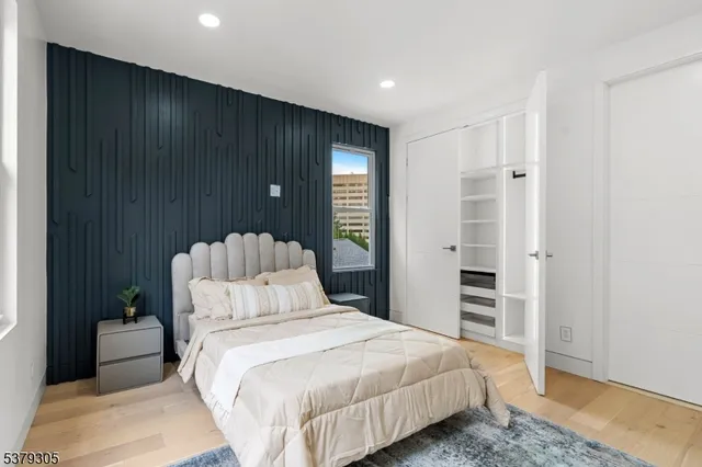 a bedroom with bed and window