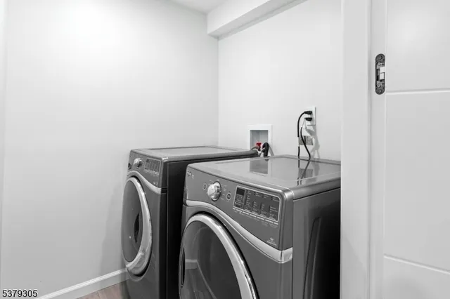 a bathroom with a shower and a sink