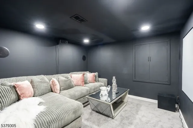 an empty room with wooden floor & windows