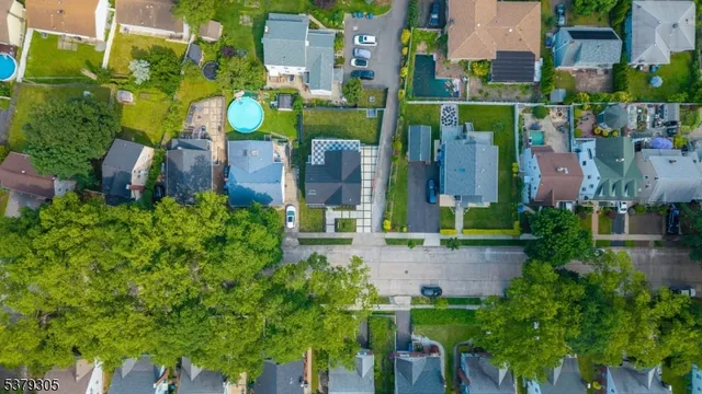 an aerial view of a house with a garden and plants
