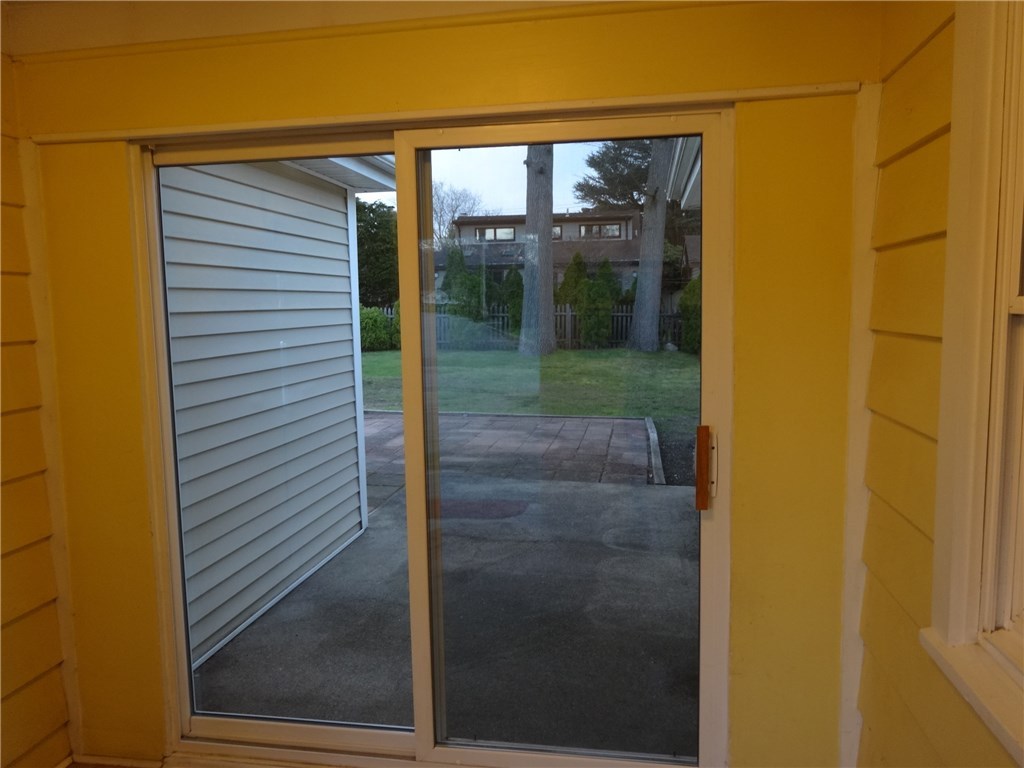 121 Rangeley Road Cranston, RI 02920 - Photo 23 of 35 Breezeway with Sliders to Patio and Backyard