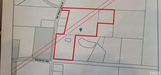 a utility room with a staircase and a window