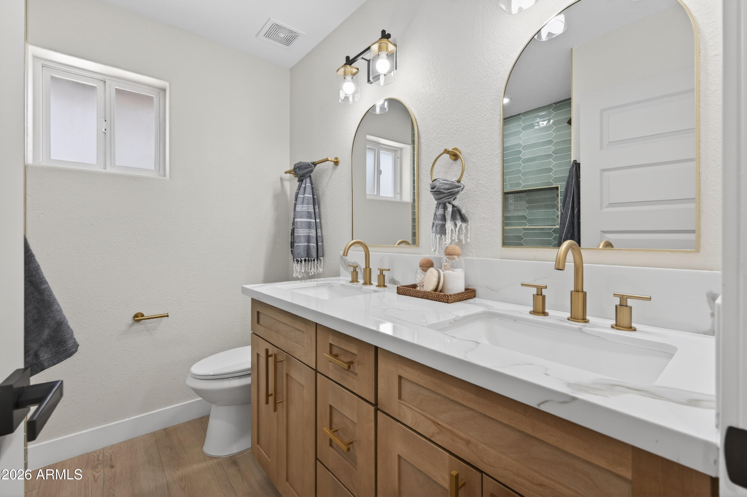 3422 South Terrace Road Tempe, AZ 85282 - Photo 21 of 43 a bathroom with a granite countertop sink vanity mirror and toilet