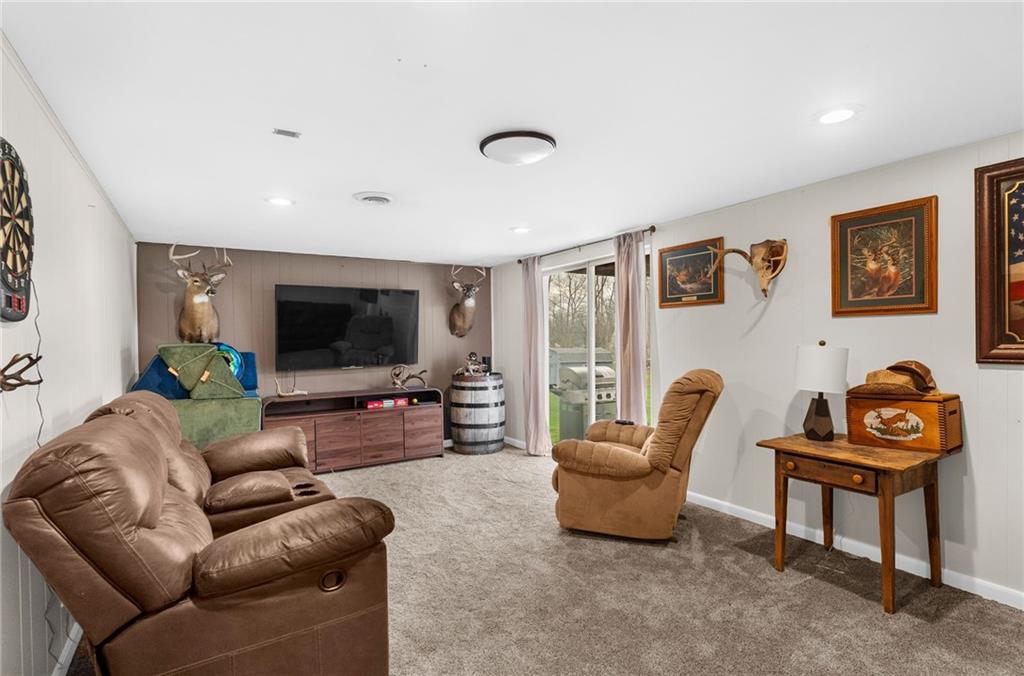 115 Milton Street Clark, PA 16113 - Photo 14 of 24 a living room with furniture and a flat screen tv