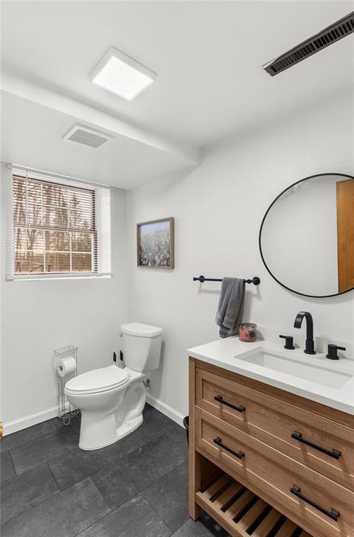 115 Milton Street Clark, PA 16113 - Photo 16 of 24 a bathroom with a toilet a sink and a mirror