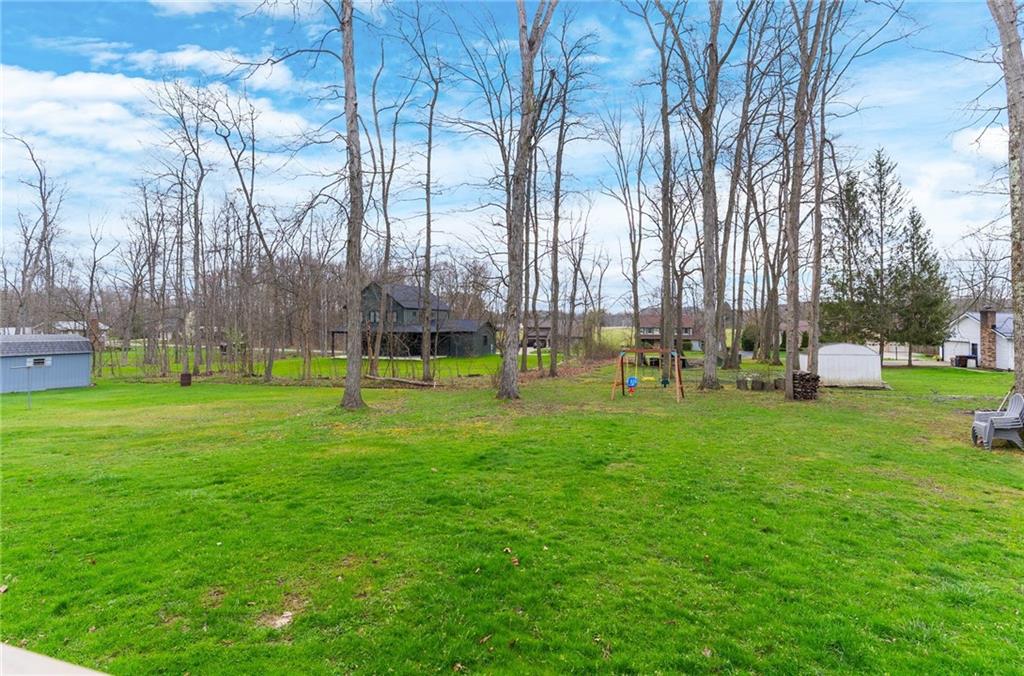 115 Milton Street Clark, PA 16113 - Photo 18 of 24 a garden with lots of trees and chairs