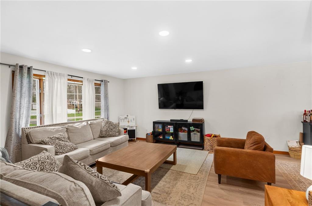 115 Milton Street Clark, PA 16113 - Photo 2 of 24 a living room with furniture and a flat screen tv