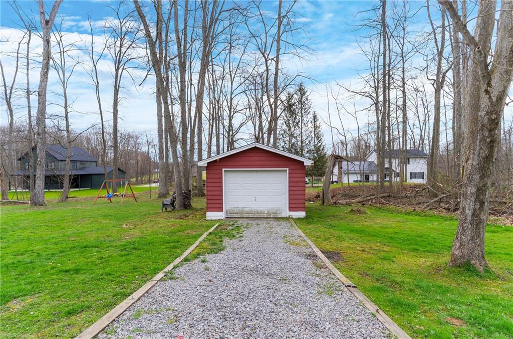 115 Milton Street Clark, PA 16113 - Photo 23 of 24 a front view of a house with garden