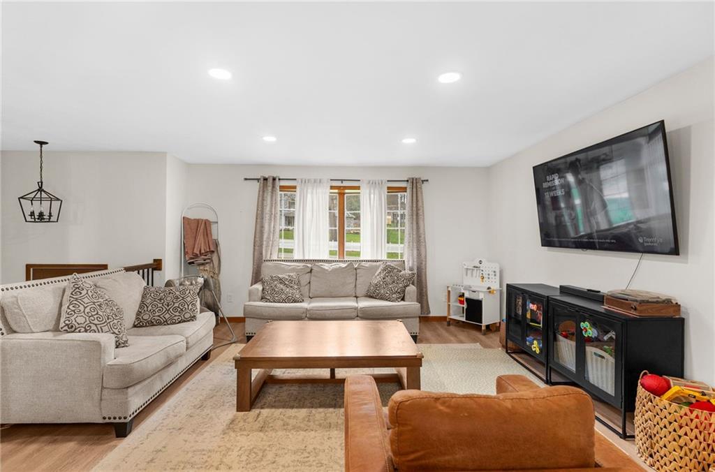 115 Milton Street Clark, PA 16113 - Photo 4 of 24 a living room with furniture and a flat screen tv