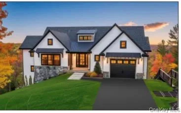 a front view of a house with a yard and trees