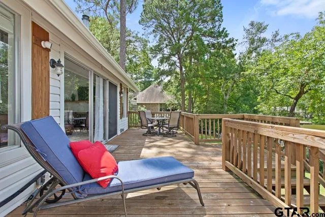 a view of deck with a table and chairs and wooden floor