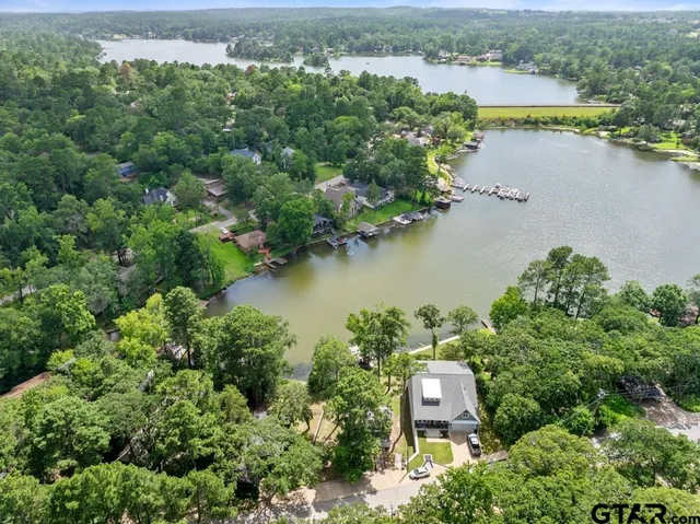 an aerial view of a city with lake view