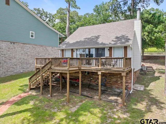 a small garden with wooden fence