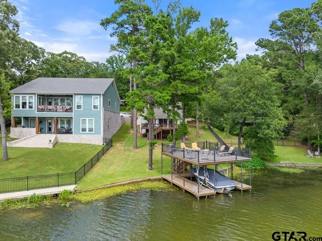 a view of a balcony with two chairs and a table
