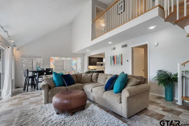 a living room with furniture and a couch