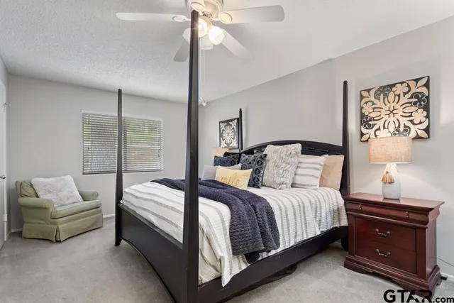 a bedroom with a bed and window