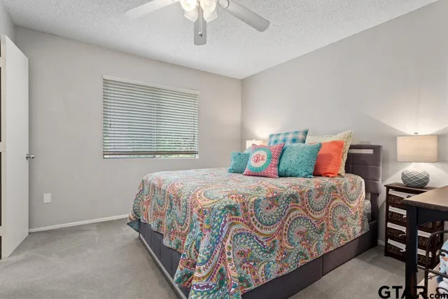 a bedroom with a bed and window