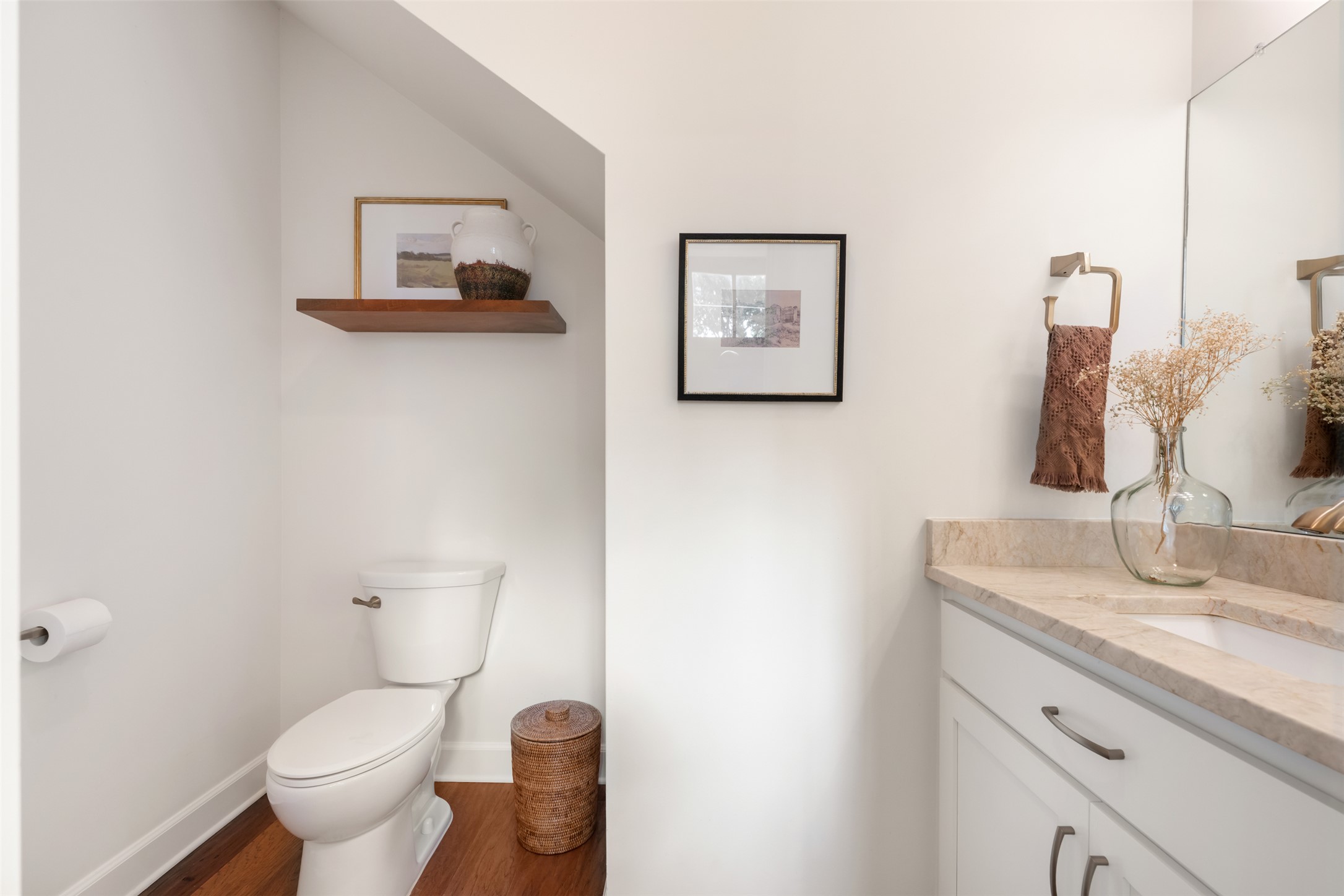 1301 West Street Georgetown, TX 78626 - Photo 27 of 40 A well-lit powder room showcases a neat vanity and convenient commode.