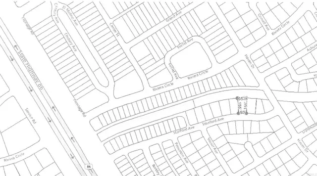 a white bench sitting in front of a building