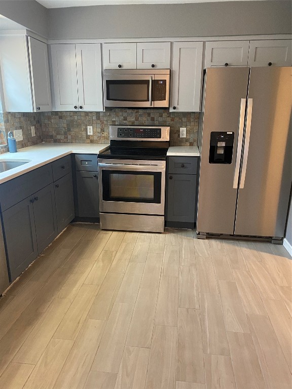 4204 Hudson Bend Road, Unit A Austin, TX 78734 - Photo 11 of 15 a kitchen with granite countertop a refrigerator stove and microwave